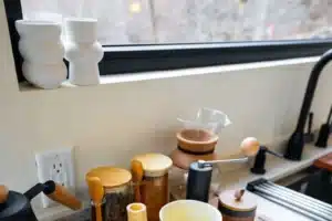 Modern kitchen countertop with white vases and organized essentials at a cabin near Shenandoah National Park