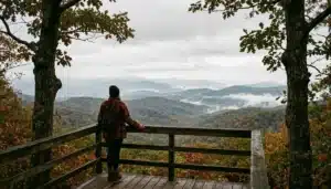 Hiker overlooking layered ridgelines in Shenandoah Valley, a top spot for activities in Virginia