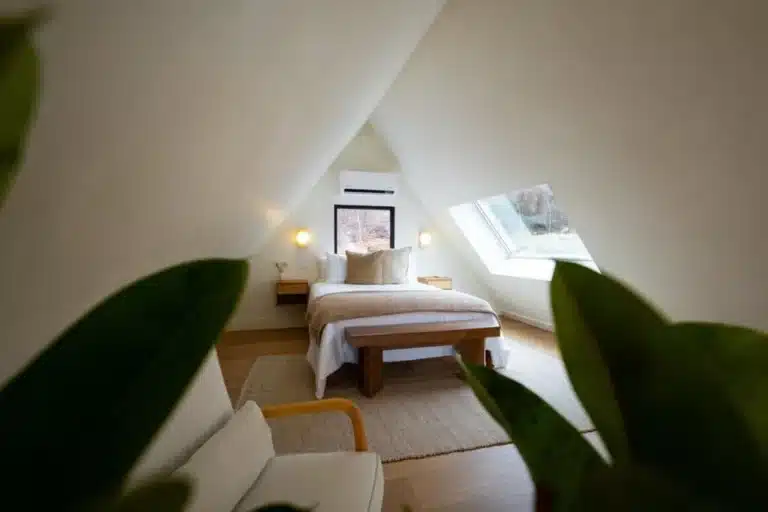 Attic bedroom with queen bed and skylight at Royal Oak Retreat in Shenandoah Valley, perfect for couples trips to Virginia