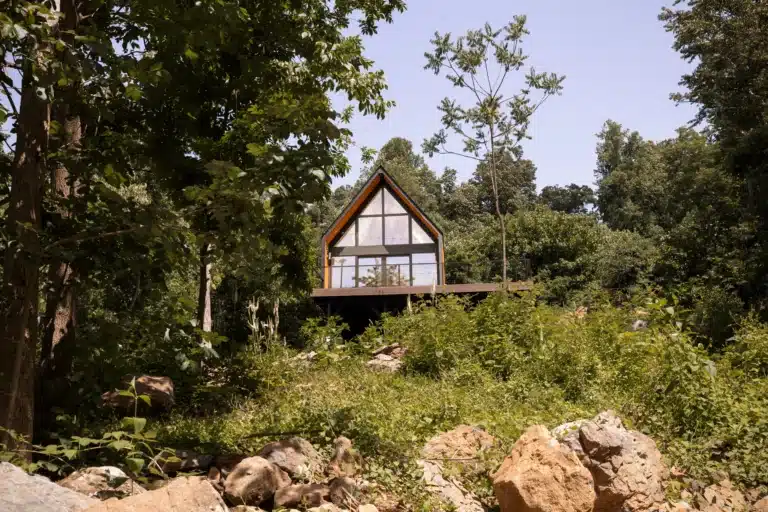 Modern treehouse accommodation with peaked roof and forest views at Royal Oak Retreat Shenandoah