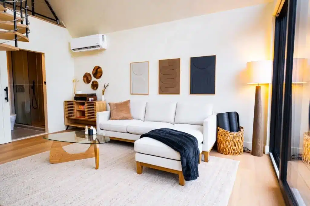 Modern living room with white sofa and wood accents in Luray VA vacation rentals