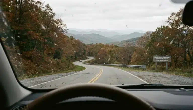 Windshield view of Skyline Drive's curving mountain road, illustrating how long it takes to drive Skyline Drive