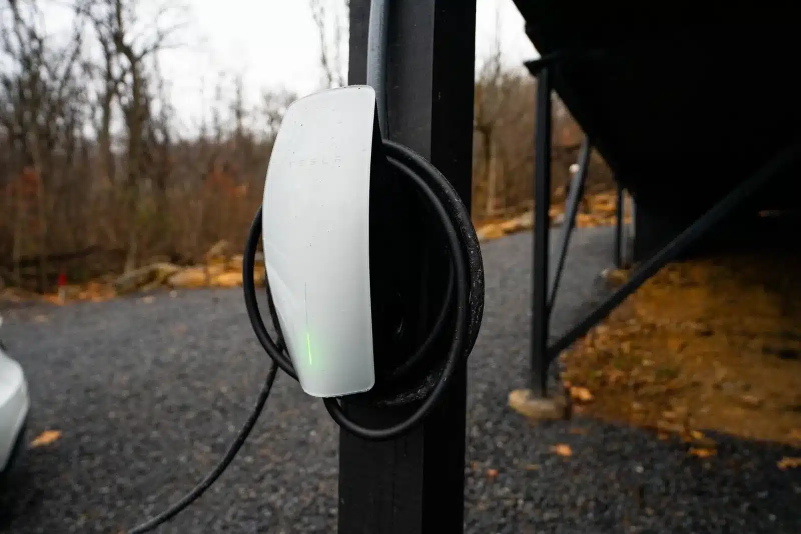 Tesla EV charging station with coiled cable on driveway at Royal Oak Retreat in Shenandoah Valley