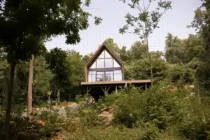 Dog-friendly A-frame tiny home with floor-to-ceiling windows in forest at Royal Oak Retreat, Shenandoah Valley