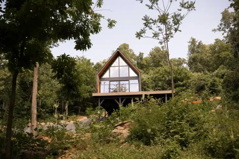 Dog-friendly A-frame tiny home with floor-to-ceiling windows in forest at Royal Oak Retreat, Shenandoah Valley
